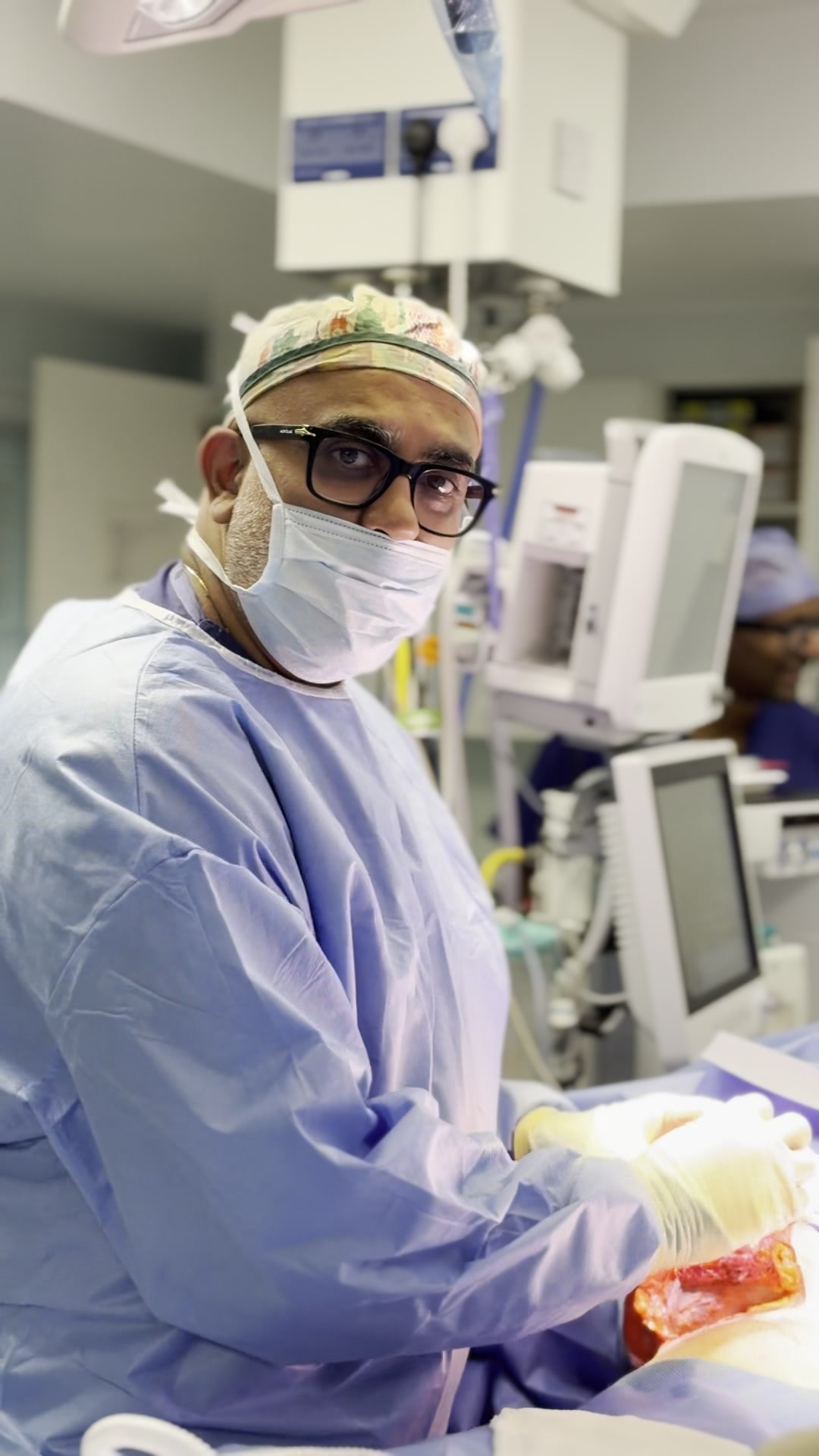 Professor Sandip Hindocha — Consultant Plastic Surgeon in theatre